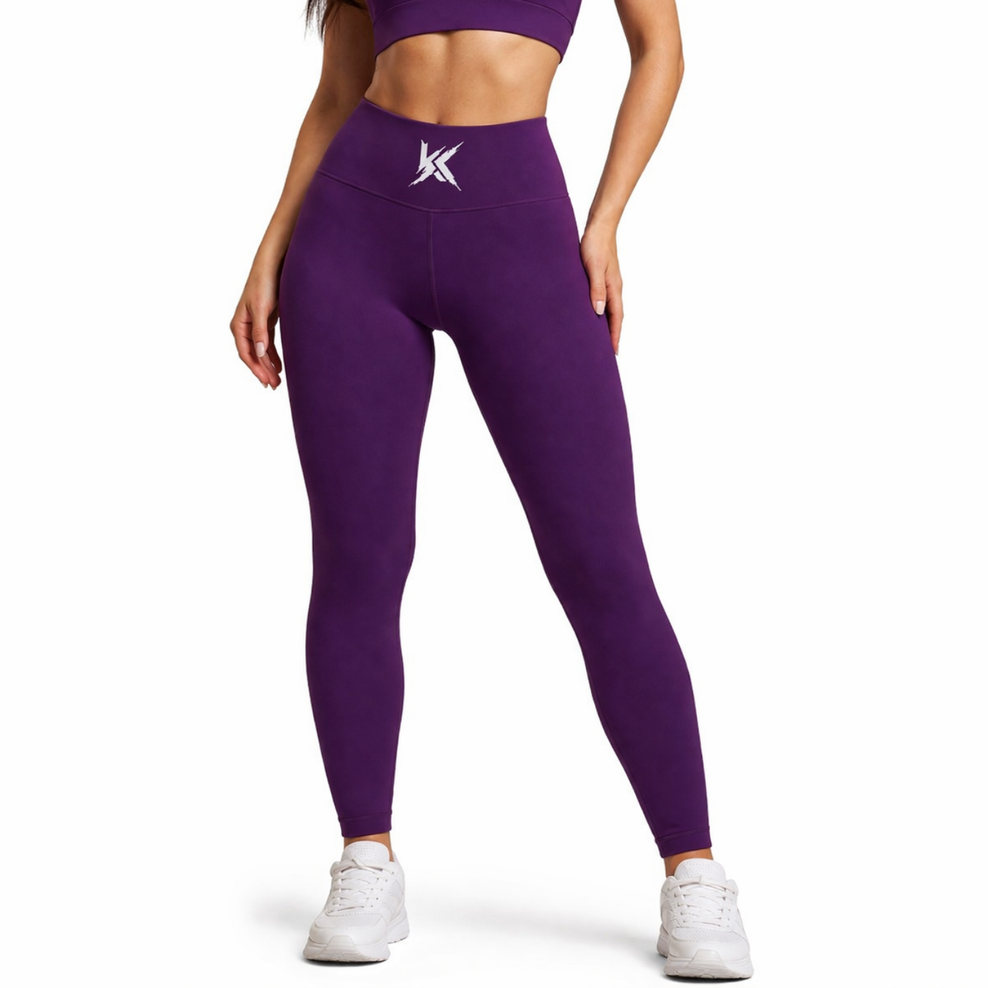 Person wearing purple leggings with a logo on a white background